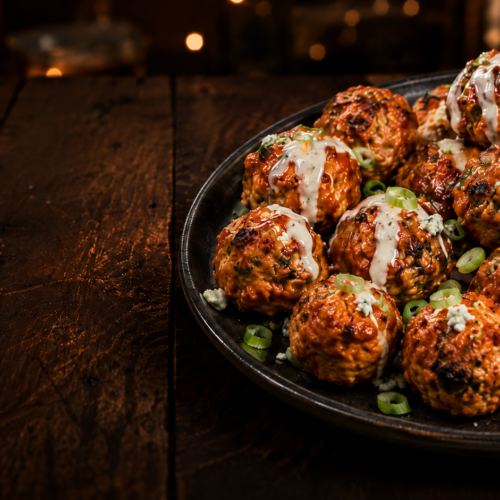 Smoked buffalo chicken meatballs coated in buffalo sauce